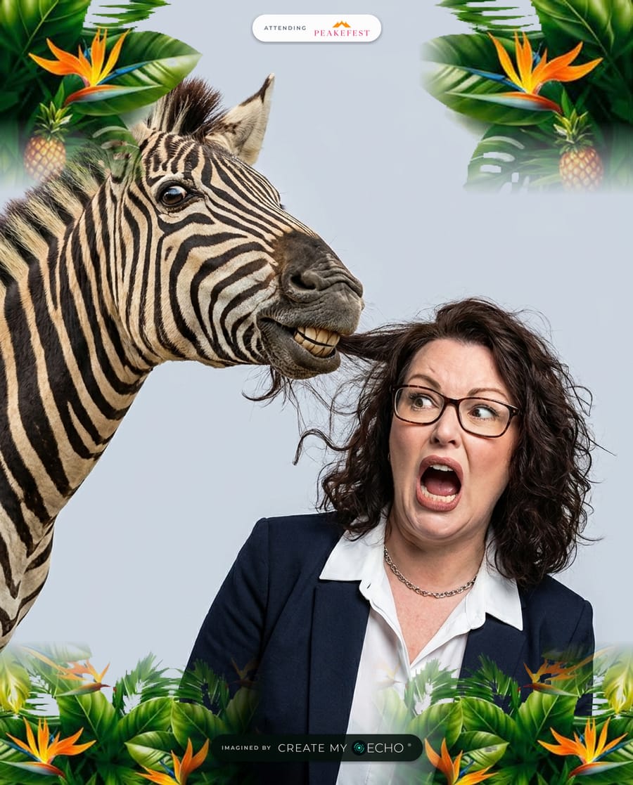 A branded PeakeFest photo: a woman in a navy blazer shrieking in a studio headshot while a zebra pulls a lock of her hair.