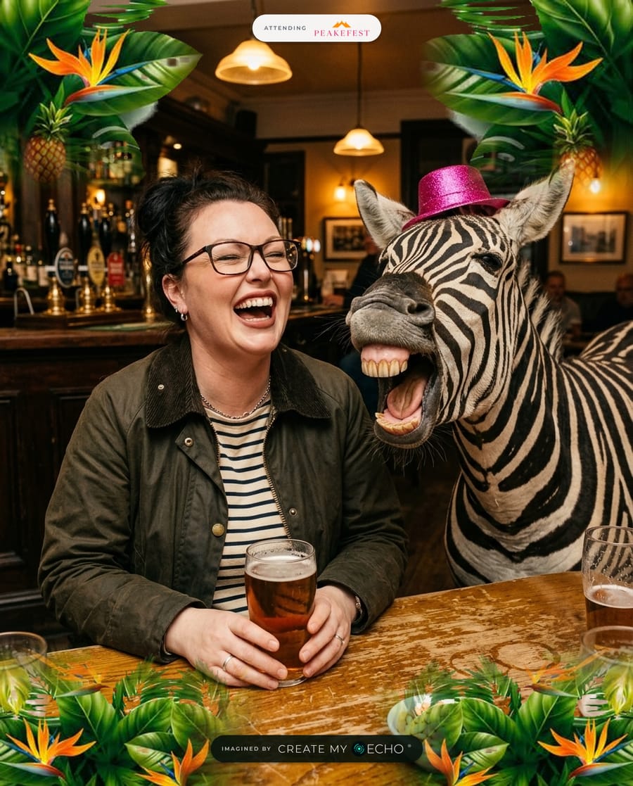 A branded PeakeFest photo: a woman roaring with laughter over a pint in a pub, next to a zebra in a pink glitter cowboy hat doing the same.